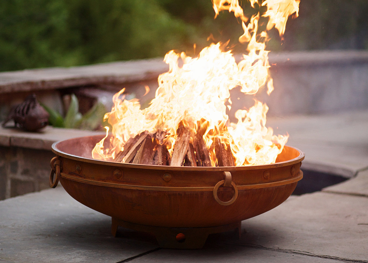 Famous artist designed fire pit bowl for outdoor gatherings around the wood burning fires