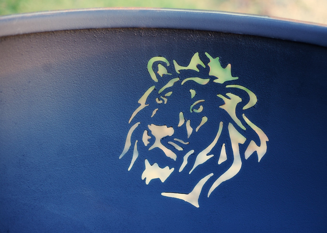 Lion head design on a blue background on fire pit bowl