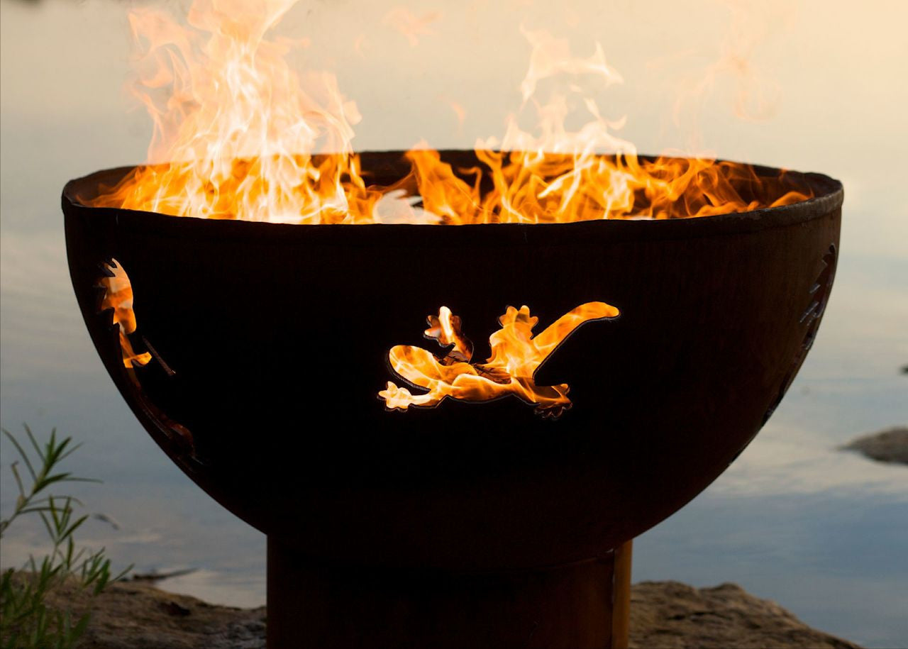 Fire pit with flames burning brightly against a natural background