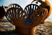 Decorative metal lantern with shell design on a natural background
