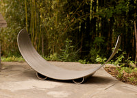 Metal sculpture to hold logs for wood burning fire pits