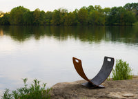 Metal sculpture to hold logs for wood burning fire pits